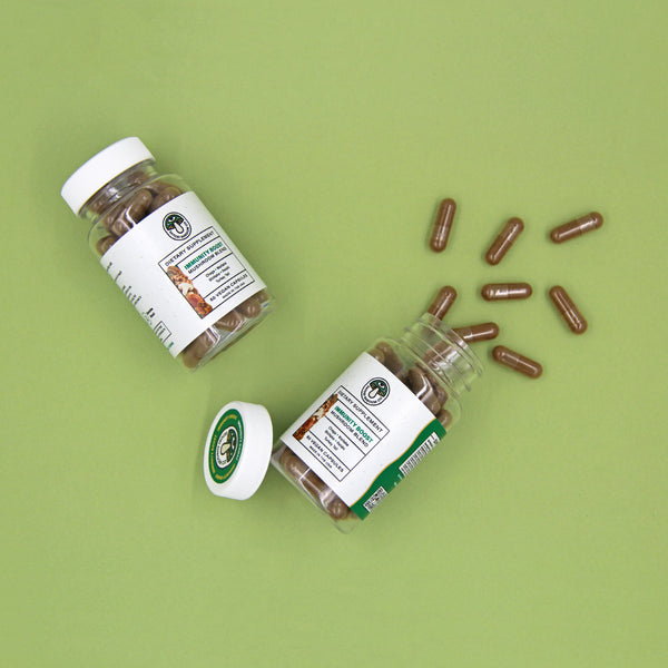 Open bottle of Immunity Boost capsules